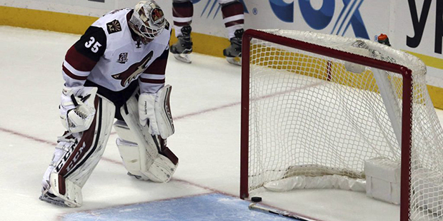 Arizona Coyotes goalie Louis Domingue (35) drops his stick and stares at the puck after the Anaheim...