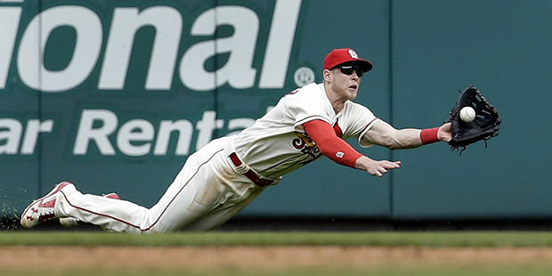 St. Louis Cardinals center fielder Jeremy Hazelbaker dives and catches a sacrifice fly by Washingto...
