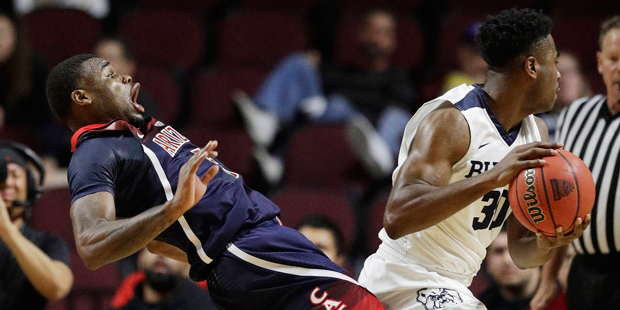 Kadeem Allen of the Arizona Wildcats attempts to draw a charge against the Butler Bulldogs in the L...
