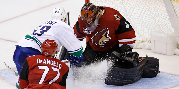 Arizona Coyotes goalie Mike Smith was pulled after a rough outing against the Vancouver Canucks in ...