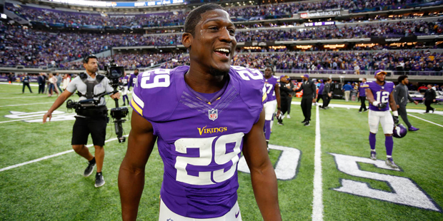 Minnesota Vikings safety Xavier Rhodes celebrates after his team's win against the Arizona Cardinal...