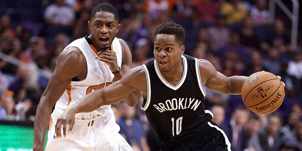 Brooklyn Nets guard Yogi Ferrell (10) dribbles around Phoenix Suns guard Brandon Knight (11) during...