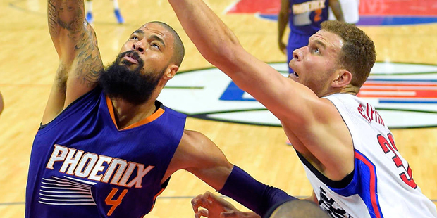 Phoenix Suns center Tyson Chandler, left, grabs a rebound away from Los Angeles Clippers forward Bl...