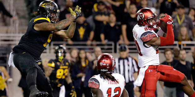 Utah defensive back Marcus Williams (20) intercepts a pass intended for Arizona State tight end Jay...