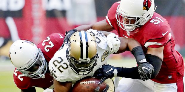 New Orleans Saints running back Mark Ingram (22) is tackled by Arizona Cardinals strong safety Tony...