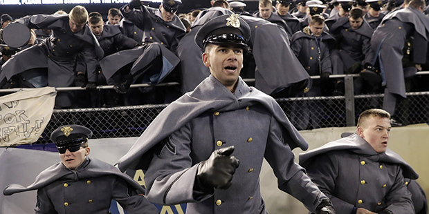 Army Cadets storm the field after the Army-Navy NCAA college football game in Baltimore, Saturday, ...
