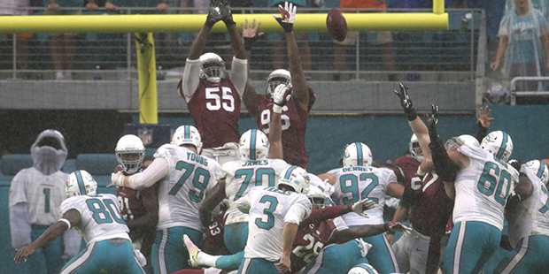Miami Dolphins kicker Andrew Franks (3) kicks the game winning goal, during the second half of an N...