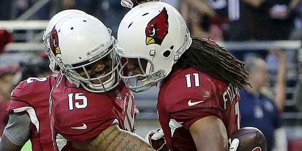 Arizona Cardinals wide receiver Michael Floyd (15) celebrates his touchdown with Larry Fitzgerald d...