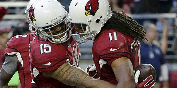 Arizona Cardinals wide receiver Michael Floyd (15) celebrates his touchdown with Larry Fitzgerald d...