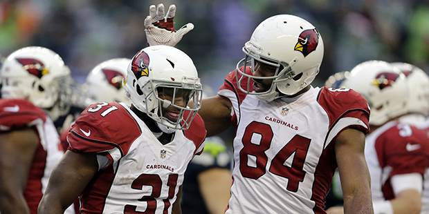 Arizona Cardinals' David Johnson (31) is congratulated by Jermaine Gresham after scoring against th...
