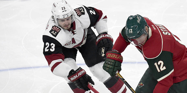 Minnesota Wild center Eric Staal (12) skates with the puck against Arizona Coyotes defenseman Olive...