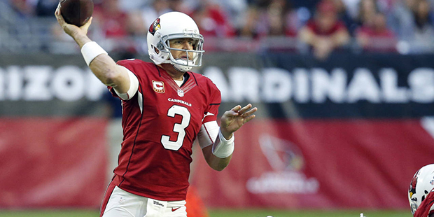 Arizona Cardinals quarterback Carson Palmer (3) throws under pressure by Washington Redskins defens...