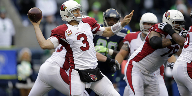 Arizona Cardinals quarterback Carson Palmer (3) throws a touchdown pass agianst the Seattle Seahawk...