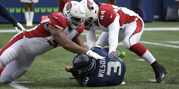 Seattle Seahawks quarterback Russell Wilson (3) is sacked by Arizona Cardinals outside linebacker M...