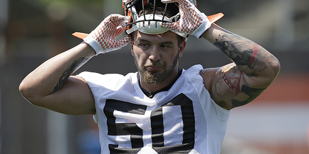 Cleveland Browns linebacker Scooby Wright III puts on his helmet during practice at the NFL footbal...