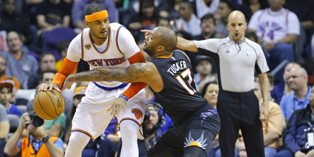 Phoenix Suns forward P.J. Tucker (17) works against New York Knicks forward Carmelo Anthony (7) in ...