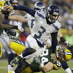Green Bay Packers' Dean Lowry sacks Seattle Seahawks quarterback Russell Wilson during the first half of an NFL football game Sunday, Dec. 11, 2016, in Green Bay, Wis. (AP Photo/Jeffrey Phelps)