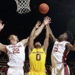 Arizona State guard Tra Holder (0) works for a rebound between Stanford forward Reid Travis (22) and guard Marcus Allen (15) during the first half of an NCAA college basketball game Friday, Dec. 30, 2016, in Stanford, Calif. (AP Photo/Marcio Jose Sanchez)