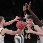 Purdue center Isaac Haas (44) is stripped of the ball by Arizona State guard Kodi Justice (44) as he drives against forward Jethro Tshisumpa (42) in the first half of an NCAA college basketball game, Tuesday, Dec. 6, 2016, in New York. (AP Photo/Julie Jacobson)