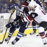 Columbus Blue Jackets' William Karlsson, left, of Sweden, and Arizona Coyotes' Max Domi fight for a loose puck during the second period of an NHL hockey game, Monday, Dec. 5, 2016, in Columbus, Ohio. (AP Photo/Jay LaPrete)