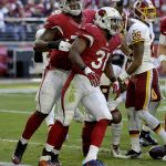 Arizona Cardinals running back David Johnson (31) celebrates his touchdown against the Washington Redskins with tackle D.J. Humphries during the first half of an NFL football game, Sunday, Dec. 4, 2016, in Glendale, Ariz. (AP Photo/Rick Scuteri)