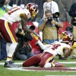 Washington Redskins cornerback Josh Norman (24) celebrates his defensive stop in the end zone with teammate free safety Will Blackmon (41) during the first half of an NFL football game against the Arizona Cardinals, Sunday, Dec. 4, 2016, in Glendale, Ariz. (AP Photo/Ross D. Franklin)
