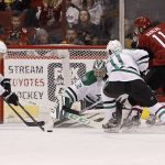 Dallas Stars' Brett Ritchie (25) tries to clear the puck after a save by goalie Kari Lehtonen (32) as Stars' Curtis McKenzie and Arizona Coyotes' Martin Hanzal battle in front of the net during the first period of an NHL hockey game, Tuesday, Dec. 27, 2016, in Glendale, Ariz. (AP Photo/Ralph Freso)