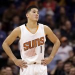 Phoenix Suns guard Devin Booker pauses during a stop in play in the second half of the team's NBA basketball game against the Houston Rockets, Wednesday, Dec. 21, 2016, in Phoenix. (AP Photo/Matt York)