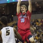 Arizona's Lauri Markkanen, right, dunks the ball over Missouri's Mitchell Smith, left, during the second half of an NCAA college basketball game Saturday, Dec. 10, 2016, in Columbia, Mo. Arizona won the game 79-60. (AP Photo/L.G. Patterson)