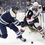Columbus Blue Jackets' Seth Jones, left, tries to clear the puck as Arizona Coyotes' Tobias Rieder, of Germany, defends during the first period of an NHL hockey game, Monday, Dec. 5, 2016, in Columbus, Ohio. (AP Photo/Jay LaPrete)