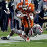 Clemson wide receiver Mike Williams (7) is stopped by Ohio State cornerback Gareon Conley (8) during the second half of the Fiesta Bowl NCAA college football playoff semifinal, Saturday, Dec. 31, 2016, in Glendale, Ariz. (AP Photo/Ross D. Franklin)