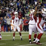 Arizona Cardinals kicker Chandler Catanzaro (7) reacts as teammates cheer after he kicked a winning field goal on the final play against the Seattle Seahawks in an NFL football game, Saturday, Dec. 24, 2016, in Seattle. (AP Photo/Ted S. Warren)