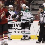 Dallas Stars' Jamie Benn (14) is congratulated by teammate Tyler Seguin, back left, after scoring a second-period goal against the Arizona Coyotes during an NHL hockey game, Tuesday, Dec. 27, 2016, in Glendale, Ariz. (AP Photo/Ralph Freso)
