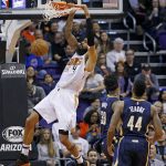 Phoenix Suns center Tyson Chandler (4) dunks the ball as he gets past Indiana Pacers center Myles Turner (33) and guard Jeff Teague (44) during the first half of an NBA basketball game Wednesday, Dec. 7, 2016, in Phoenix. (AP Photo/Ross D. Franklin)