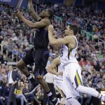 Phoenix Suns guard Brandon Knight, left, goes to the basket as Utah Jazz guard Raul Neto, right, defends in the first half during an NBA basketball game Saturday, Dec. 31, 2016, in Salt Lake City. (AP Photo/Rick Bowmer)