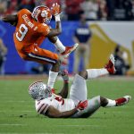 Clemson running back Wayne Gallman (9) escapes the tackle of Ohio State linebacker Raekwon McMillan (5)during the first half of the Fiesta Bowl NCAA college football playoff semifinal, Saturday, Dec. 31, 2016, in Glendale, Ariz. (AP Photo/Ross D. Franklin)