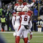 Arizona Cardinals congratulate Chandler Catanzaro (7) on his winning field goal on the final play against the Seattle Seahawks in an NFL football game, Saturday, Dec. 24, 2016, in Seattle. (AP Photo/Ted S. Warren)