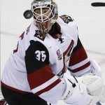 Arizona Coyotes goalie Louis Domingue (35) looks back for the rebound off the goal cage during the second period of an NHL hockey game against the Pittsburgh Penguins in Pittsburgh, Monday, Dec. 12, 2016. (AP Photo/Gene J. Puskar)