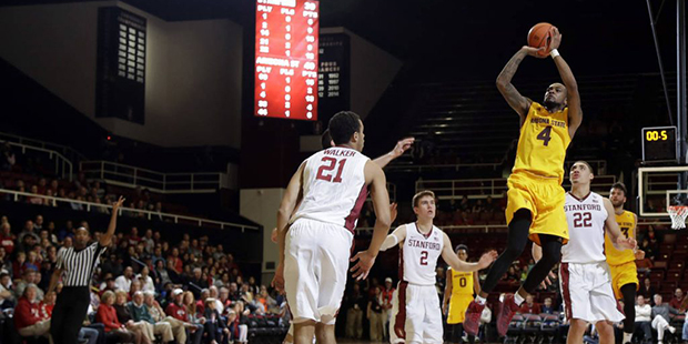 Arizona State guard Torian Graham (4) makes a shot at the buzzer during the first half of an NCAA c...