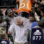 Baylor head coach Jim Grobe gets doused by his players after the Cactus Bowl NCAA college football game against Boise State, Tuesday, Dec. 27, 2016, in Phoenix. Baylor won 31-12. (AP Photo/Matt York)