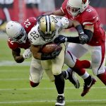 New Orleans Saints running back Mark Ingram (22) is tackled by Arizona Cardinals strong safety Tony Jefferson (22) and middle linebacker Kevin Minter (51) during the first half of an NFL football game, Sunday, Dec. 18, 2016, in Glendale, Ariz. (AP Photo/Rick Scuteri)