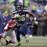 Seattle Seahawks' Alex Collins carries against the Arizona Cardinals in the second half of an NFL football game, Saturday, Dec. 24, 2016, in Seattle. (AP Photo/John Froschauer)