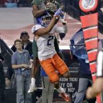 Baylor wide receiver KD Cannon pulls in a touchdown catch as Boise State cornerback Jonathan Moxey (2) defends during the first half of the Cactus Bowl NCAA college football game, Tuesday, Dec. 27, 2016, in Phoenix. (AP Photo/Rick Scuteri)p