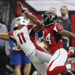 FILE - In this Nov. 27, 2016, file photo, Arizona Cardinals wide receiver Larry Fitzgerald (11) makes a one-handed catch against Atlanta Falcons cornerback Brian Poole (34) during the first half of an NFL football game, in Atlanta. Fitzgerald has caught a pass in 191 consecutive games, third-longest streak in NFL history. The Cardinals take on the Miami Dolphins on Sunday in Miami Gardens, Fla.  (AP Photo/John Bazemore, File)