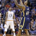 Indiana Pacers guard Jeff Teague (44) celebrates his score as Phoenix Suns forward P.J. Tucker (17) pauses on the court during the second half of an NBA basketball game Wednesday, Dec. 7, 2016, in Phoenix. The Pacers defeated the Suns 109-94. (AP Photo/Ross D. Franklin)