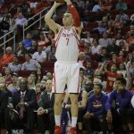 Houston Rockets forward Sam Dekker (7) shoots a three-point shot against the Phoenix Suns in the first half of an NBA basketball game on Monday, Dec. 26, 2016 in Houston. (AP Photo/Bob Levey)
