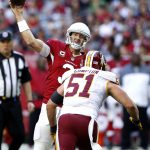 Arizona Cardinals quarterback Carson Palmer (3) throws as Washington Redskins inside linebacker Will Compton (51) defends during the first half of an NFL football game, Sunday, Dec. 4, 2016, in Glendale, Ariz. (AP Photo/Ross D. Franklin)
