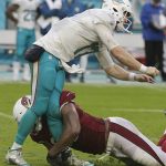 Arizona Cardinals defensive end Calais Campbell (93) tackles Miami Dolphins quarterback Ryan Tannehill (17), during the second half of an NFL football game, Sunday, Dec. 11, 2016, in Miami Gardens, Fla. Tannehill was injured on the play. (AP Photo/Lynne Sladky)