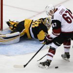 Arizona Coyotes' Lawson Crouse (67) can't get his stick on a rebound off Pittsburgh Penguins goalie Matt Murray (30) in the first period of an NHL hockey game in Pittsburgh, Monday, Dec. 12, 2016. (AP Photo/Gene J. Puskar)