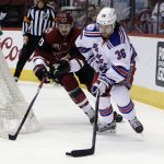 New York Rangers right wing Mats Zuccarello (36) shields Arizona Coyotes defenseman Oliver Ekman-Larsson from the puck during the first period of an NHL hockey game, Thursday, Dec. 29, 2016, in Glendale, Ariz. (AP Photo/Rick Scuteri)